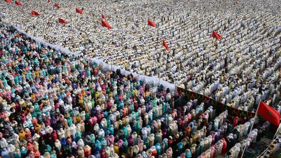 Moroccan Muslim women (L) and men (R) perform prayers for Eid al-Fitr which marks the end of the Muslim holy fasting month of Ramadan in the city of Sale, north of the Moroccan capital Rabat, on July 18, 2015. AFP PHOTO/ FADEL SENNA (Photo credit should read FADEL SENNA/AFP/Getty Images)