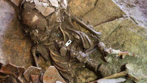 A handout picture taken on July 19, 2018 provided by the British Museum's archeological excavation team in Sidon, southern Lebanon, shows the remains a Canaanite child and its funerary jar, found with a necklace around the neck. - According to Doctor Claude Serhal, head of the British Museum's archeological excavation team (working since 1998), most of the recent finds on the site of the ancient city of Sidon, a medieval defensive tower in addition to pottery, emphasized the historical richness of the city and showing the rituals of the Canaanites, Phoenicians, and other historical tribes. (Photo by - / The British Museum / AFP)